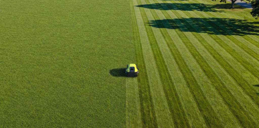 PUDU GT5 cortando gramado com striping profissional em larga escala